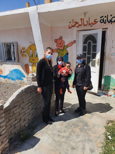 CSR representative with community members during the International Women's Day outreach in Ras Ghareb.