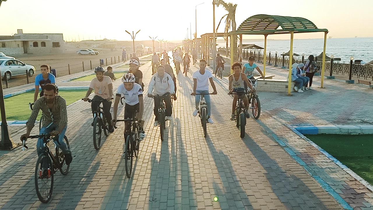 Community cycling along the Ras Ghareb Corniche during the International Environmental Day celebrations.