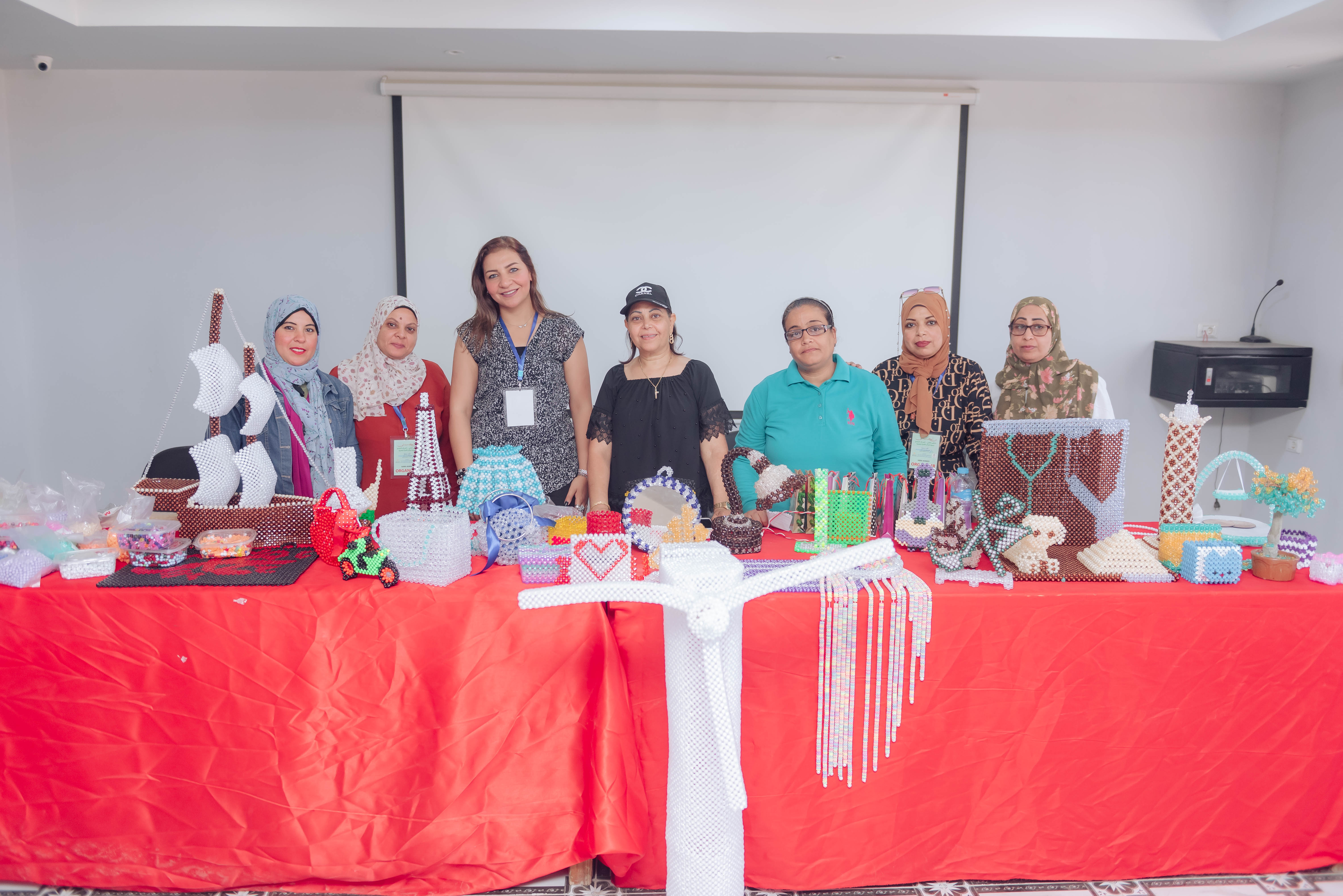 Participants of the For You Madam II cohort presenting their handmade crafts at the closing showcase.