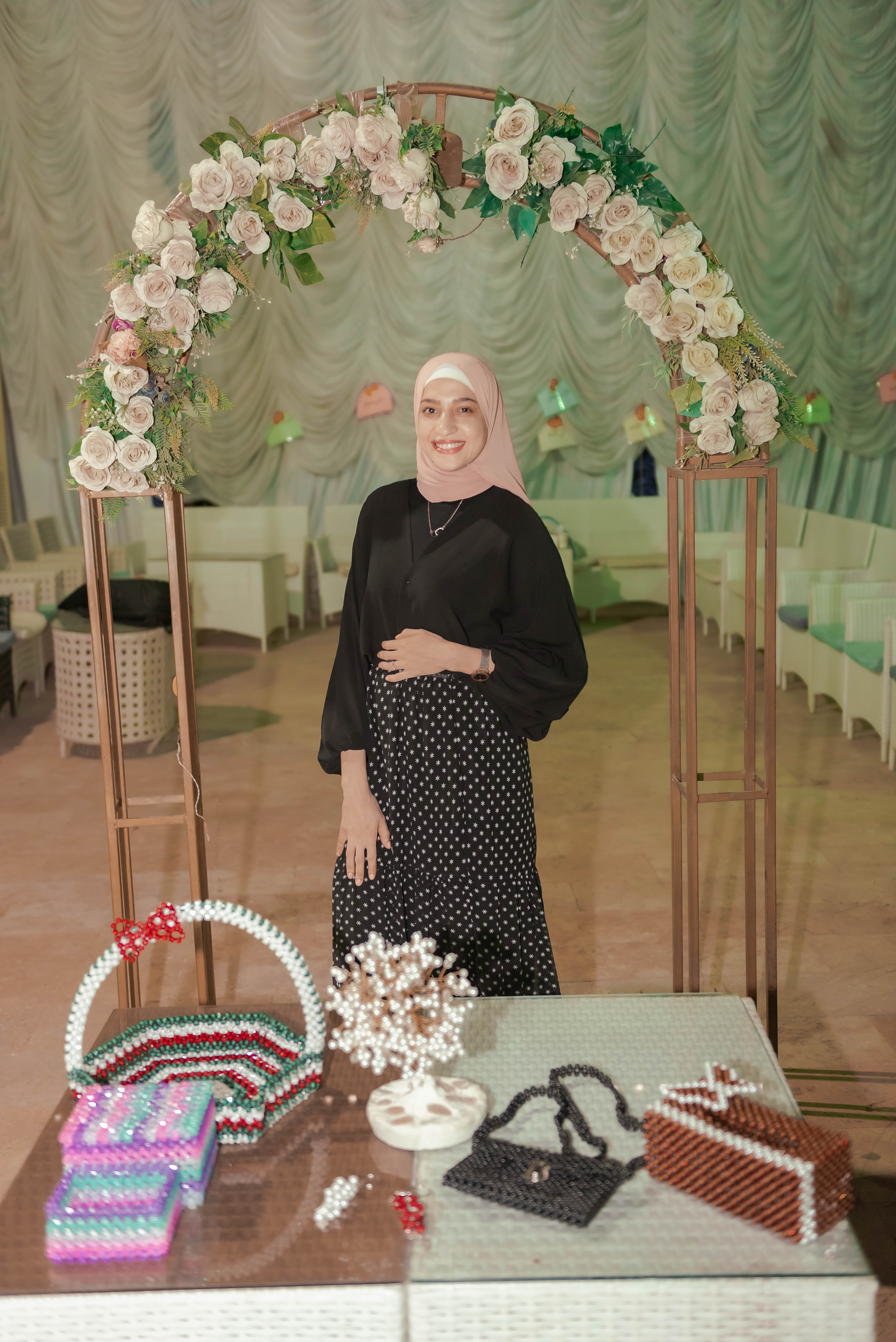 A For You Madam II graduate alongside her handcrafted work at the closing exhibition.